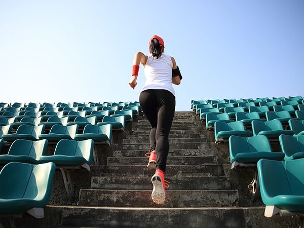 girl running up the stairs