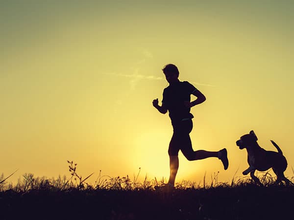 guy running with his dog