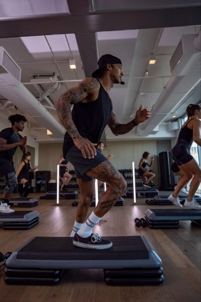 guy with tattoos working out at fit athletic club