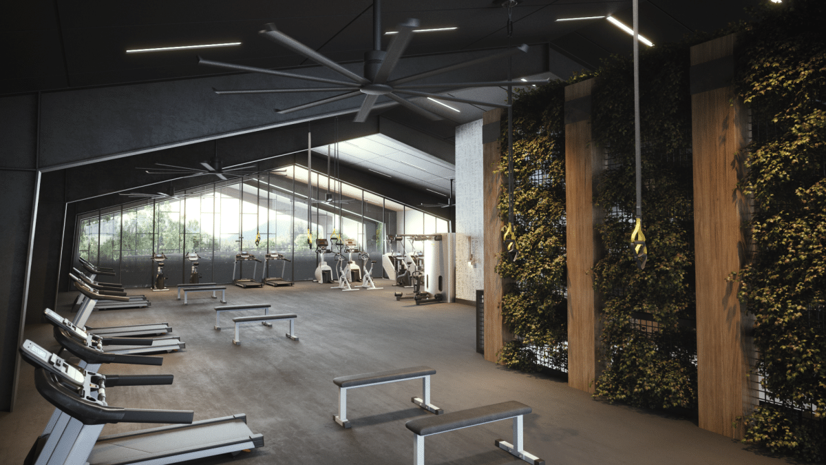 An image of a gym with plants on the wall.