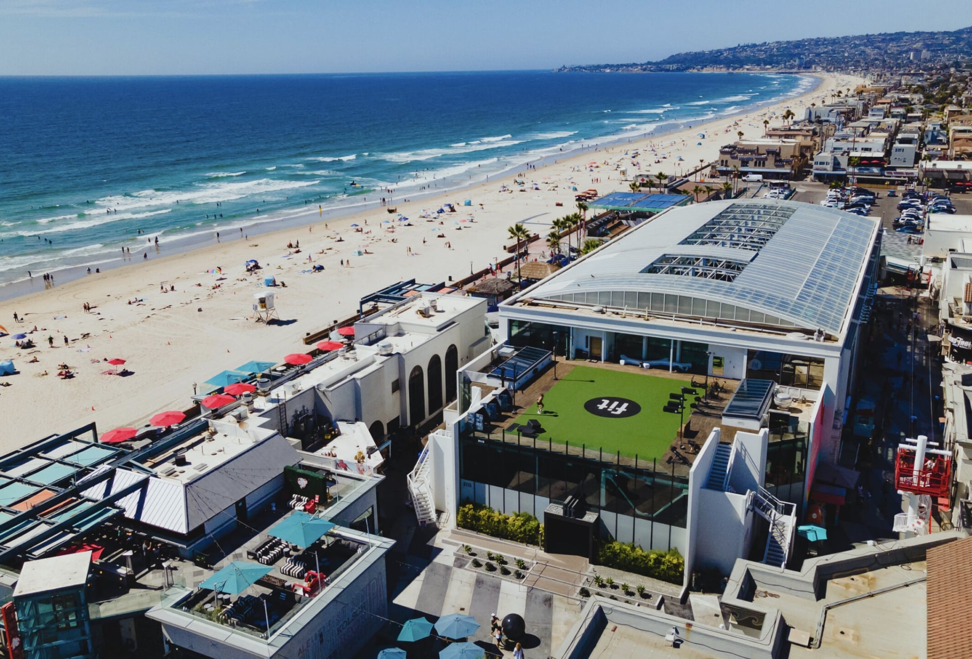 An aerial view of a beach and a building.