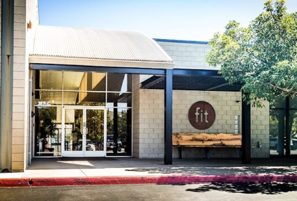 The entrance to a building with a sign that says fit.